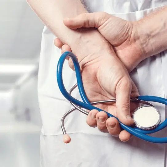 Care worker supporting an older adult at home