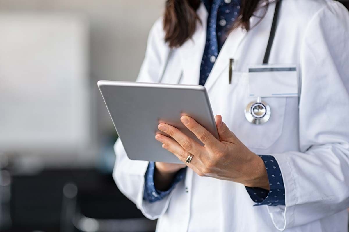 Healthcare professional using a tablet